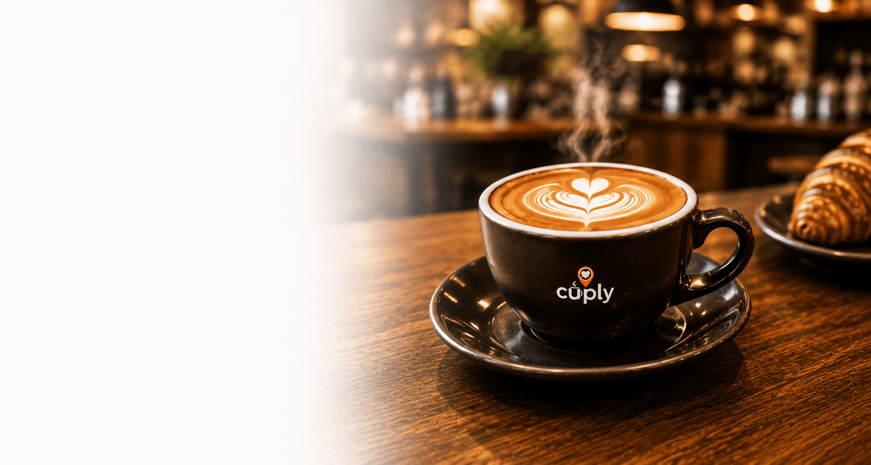 Latte art in a coffee cup on a wooden table